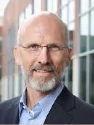 Jack in front of a tall building